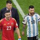 Argentina's Lionel Messi, right, leaves the field with teammate goalkeeper Emiliano Martinez after their loss in the World Cup group C soccer match between Argentina and Saudi Arabia at the Lusail Stadium in Lusail, Qatar, Tuesday, Nov. 22, 2022. (AP Photo/Luca Bruno)