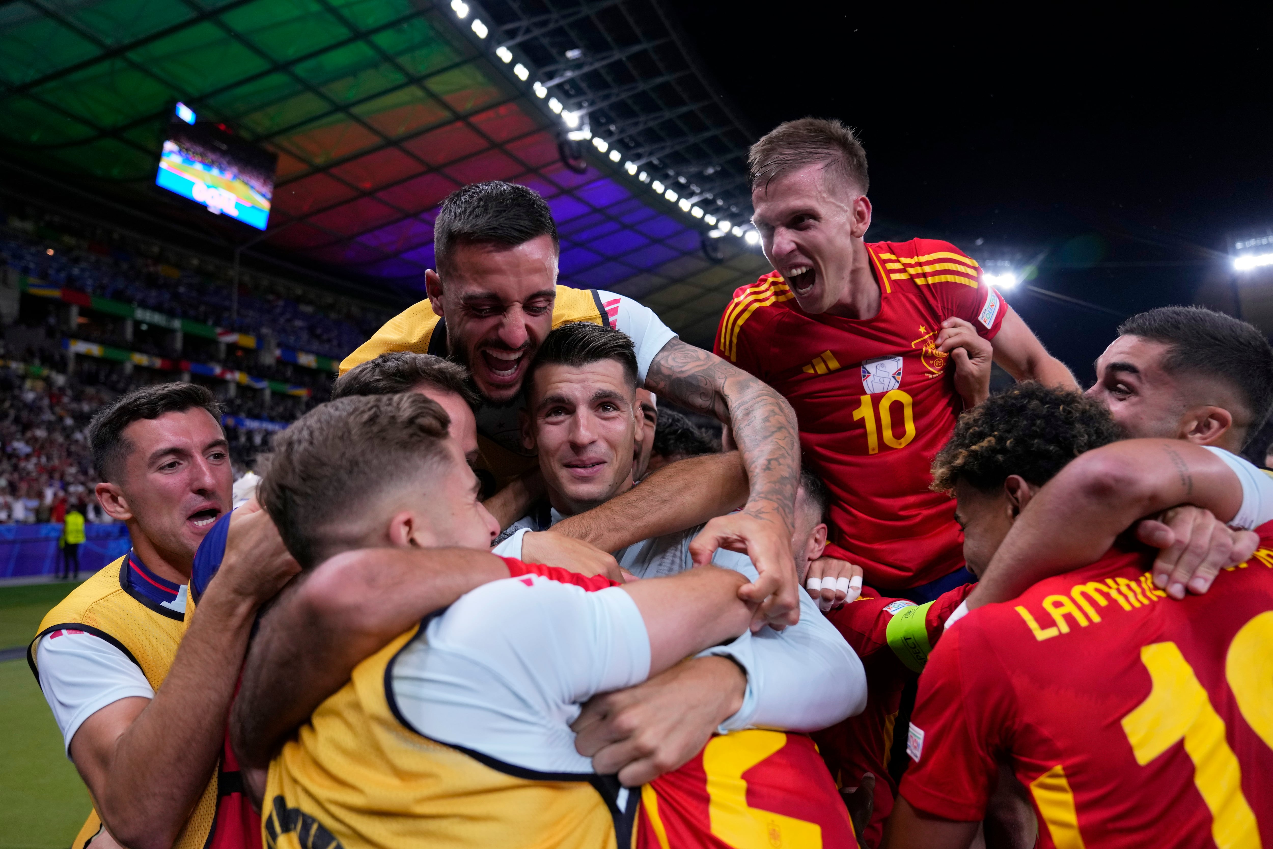 Spain players celebrate after Mikel Oyarzabal scored their side's second goal during the final match between Spain and England at the Euro 2024 soccer tournament in Berlin, Germany, Sunday, July 14, 2024. (AP Photo/Manu Fernandez)