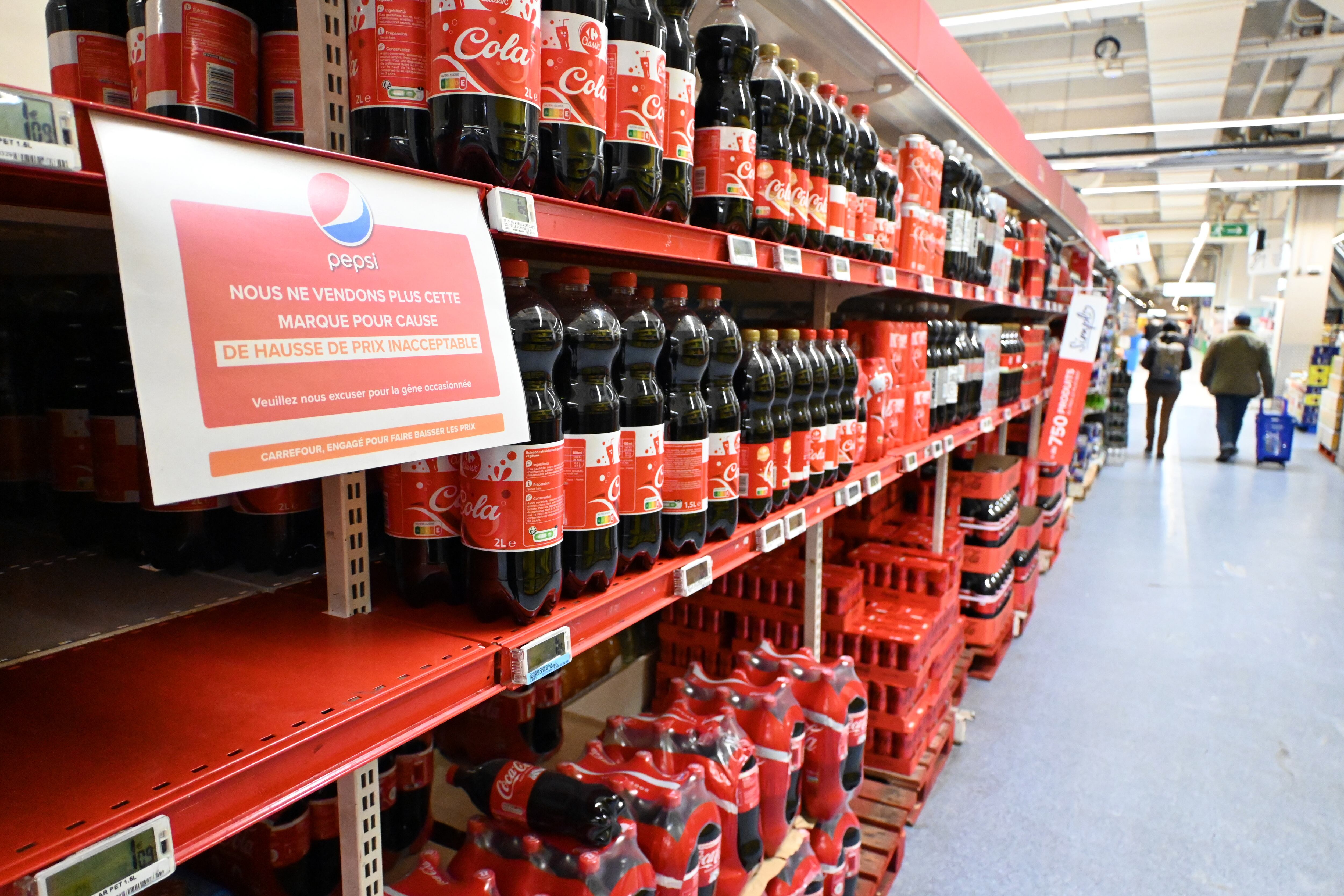 PARIS, FRANCE - JANUARY 05: A sign reading in French in a Carrefour on a shelf for the PepsiCo product Doritos' reads: 'We no longer sell this brand due to unacceptable price increases' at a Carrefour Group store in Montigny-le-Bretonneux, near Paris, France on January 05, 2024. French Multinational retail and wholesaling corporation Carrefour, stop selling PepsiCo products in their stores in four European countries due to prices. (Photo by Mustafa Yalcin/Anadolu via Getty Images)