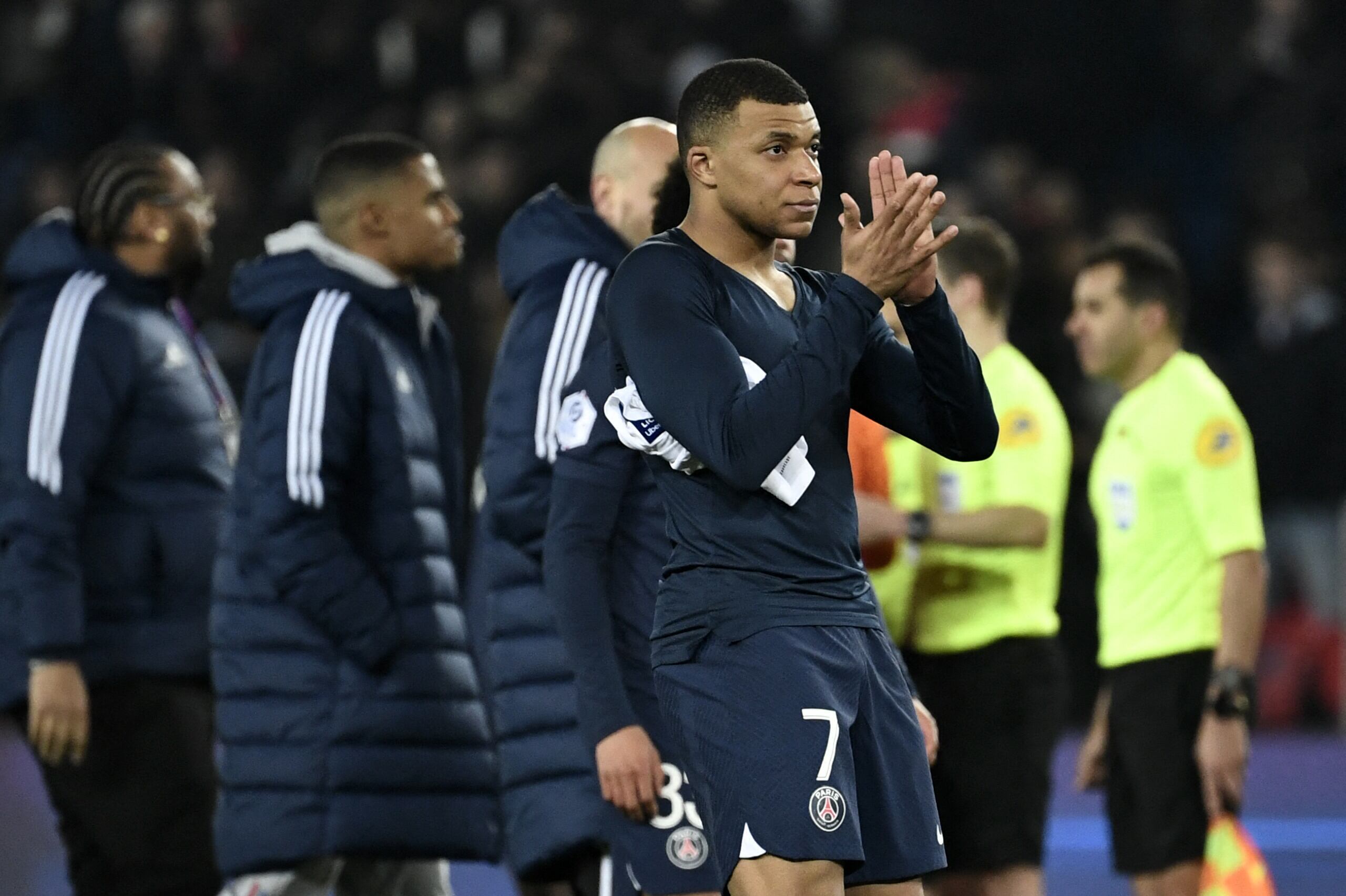 Paris Saint-Germain's French forward Kylian Mbappe applauds at the end of the French L1 football match between Paris Saint-Germain (PSG) and Olympique Lyonnais (OL) at The Parc des Princes Stadium in Paris on April 2, 2023. (Photo by STEPHANE DE SAKUTIN / AFP)