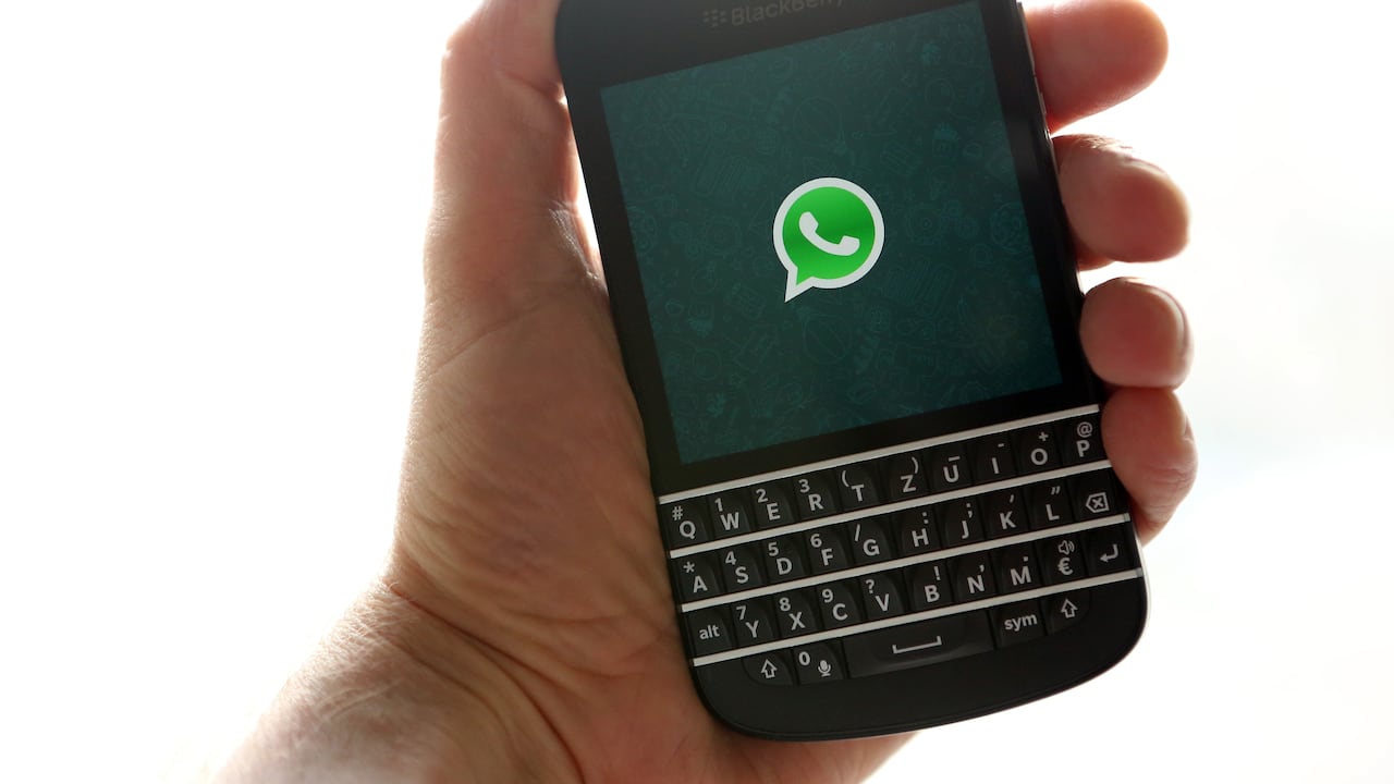 BERLIN, GERMANY - FEBRUARY 20: In this photo ilustration, the WhatsApp startup screen is seen on a Blackberry Q10 mobile phone on February 20, 2014 in Berlin, Germany. The social network company Facebook has agreed to purchase the largest mobile message service, WhatsApp, for at leastt USD 16 billion in cash and shares. (Photo Illustration by Adam Berry/Getty Images)