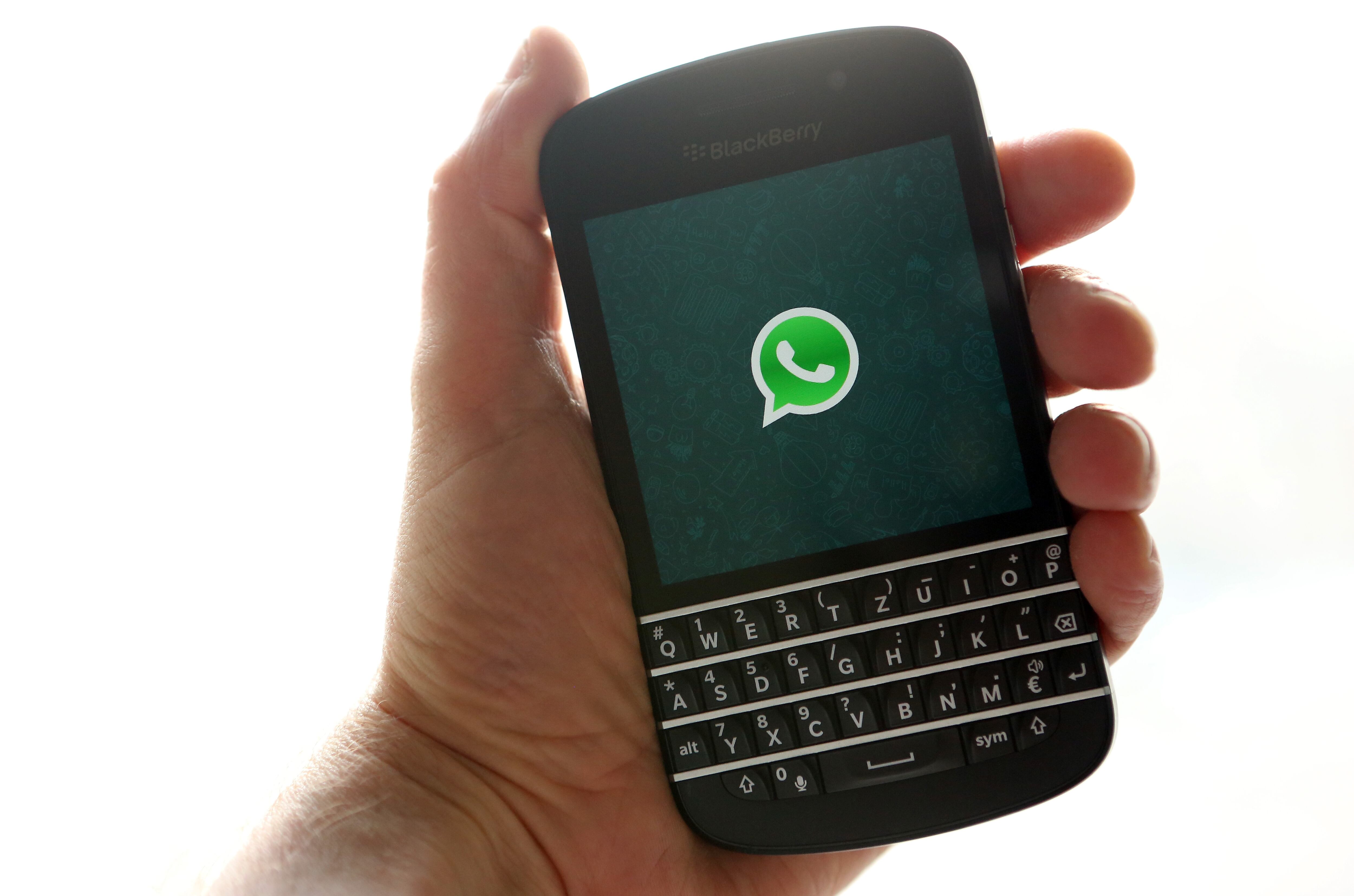 BERLIN, GERMANY - FEBRUARY 20:  In this photo ilustration, the WhatsApp startup screen is seen on a Blackberry Q10 mobile phone on February 20, 2014 in Berlin, Germany. The social network company Facebook has agreed to purchase the largest mobile message service, WhatsApp, for at leastt USD 16 billion in cash and shares.  (Photo Illustration by Adam Berry/Getty Images)