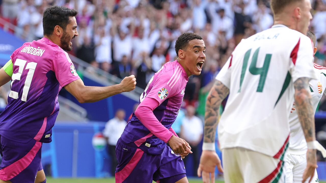 STUTTGART, GERMANY - JUNE 19: (R) Jamal Musiala of Germany celebrates with his team Mate Ilkay Gündogan his teams first goal during the UEFA EURO 2024 group stage match between Germany and Hungary at Stuttgart Arena on June 19, 2024 in Stuttgart, Germany.(Photo by Sebastian El-Saqqa - firo sportphoto/Getty Images)