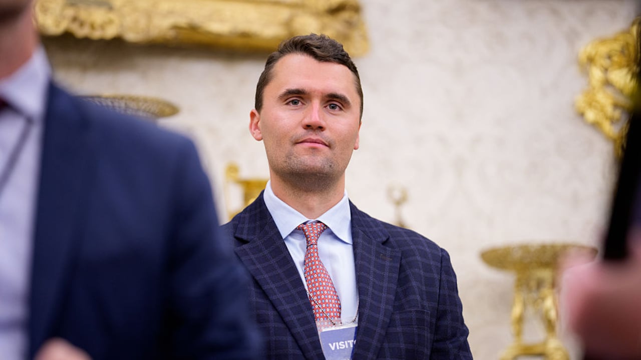WASHINGTON, DC - MAY 28: Turning Point USA co-founder Charlie Kirk stands in the back of the room as U.S. President Donald Trump speaks during a swearing in ceremony for interim U.S. Attorney for Washington, D.C. Jeanine Pirro in the Oval Office of the White House on May 28, 2025 in Washington, DC. Trump has announced Pirro, a former Fox News personality, judge, prosecutor, and politician, after losing support in the Senate for his first choice, Ed Martin, over his views on the January 6, 2021 attack on the U.S. Capitol. (Photo by Andrew Harnik/Getty Images)