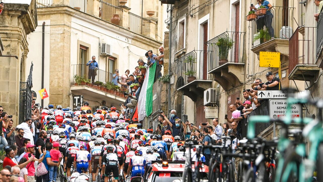 Cyclists pedal along a village during the third stage of the Giro d'Italia, tour of Italy cycling race from Enna to Etna, Sicily, Monday, Oct. 5, 2020. (Fabio Ferrari/LaPresse via AP)