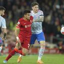 Liverpool's Luis Diaz, center, fights for the ball with Manchester United's Victor Lindelof during the English Premier League soccer match between Liverpool and Manchester United at Anfield stadium in Liverpool, England, Tuesday, April 19, 2022. (AP Photo/Jon Super)