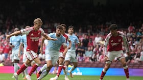 Arsenal's Martin Odegaard, left, scores his side's third goal during the FA Community Shield final soccer match between Arsenal and Manchester City in Cardiff, Wales, Sunday, Aug.16, 2026. (AP Photo/Alastair Grant)