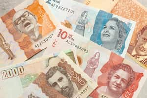 Colombian money, various banknotes filling the frame