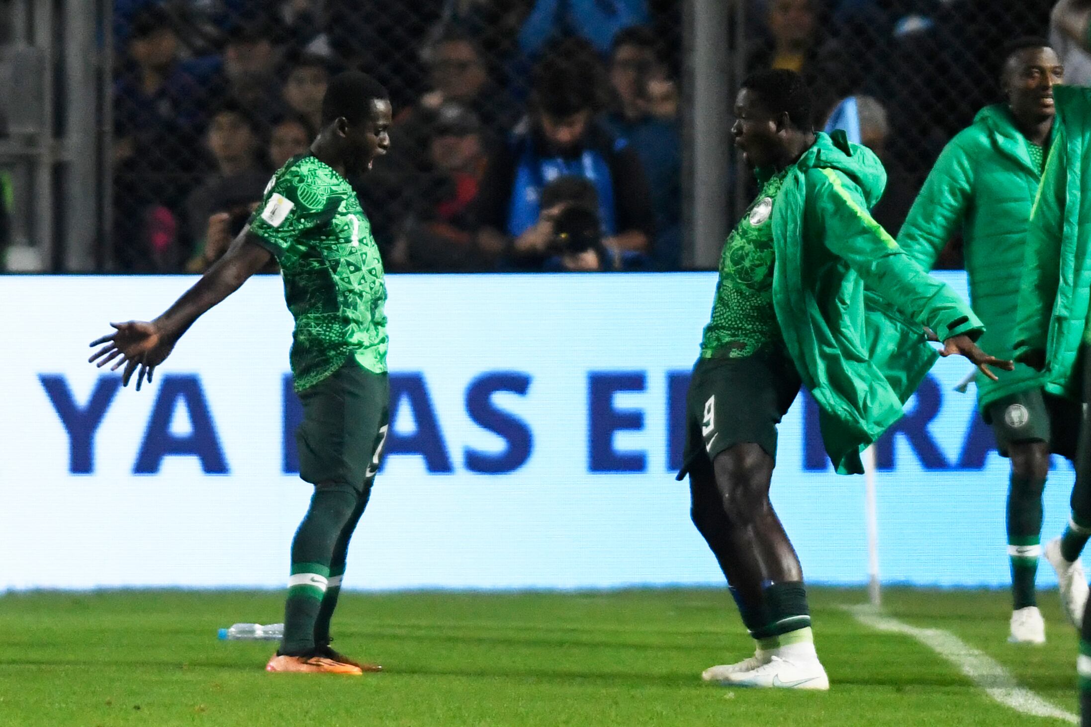 Nigeria's forward Rilwanu Haliru Sarki (L) celebrates with teammates after scoring his team's second goal during the Argentina 2023 U-20 World Cup round of 16 football match between Argentina and Nigeria at the San Juan del Bicentenario stadium in San Juan, Argentina, on May 31, 2023. (Photo by Andres Larrovere / AFP)
