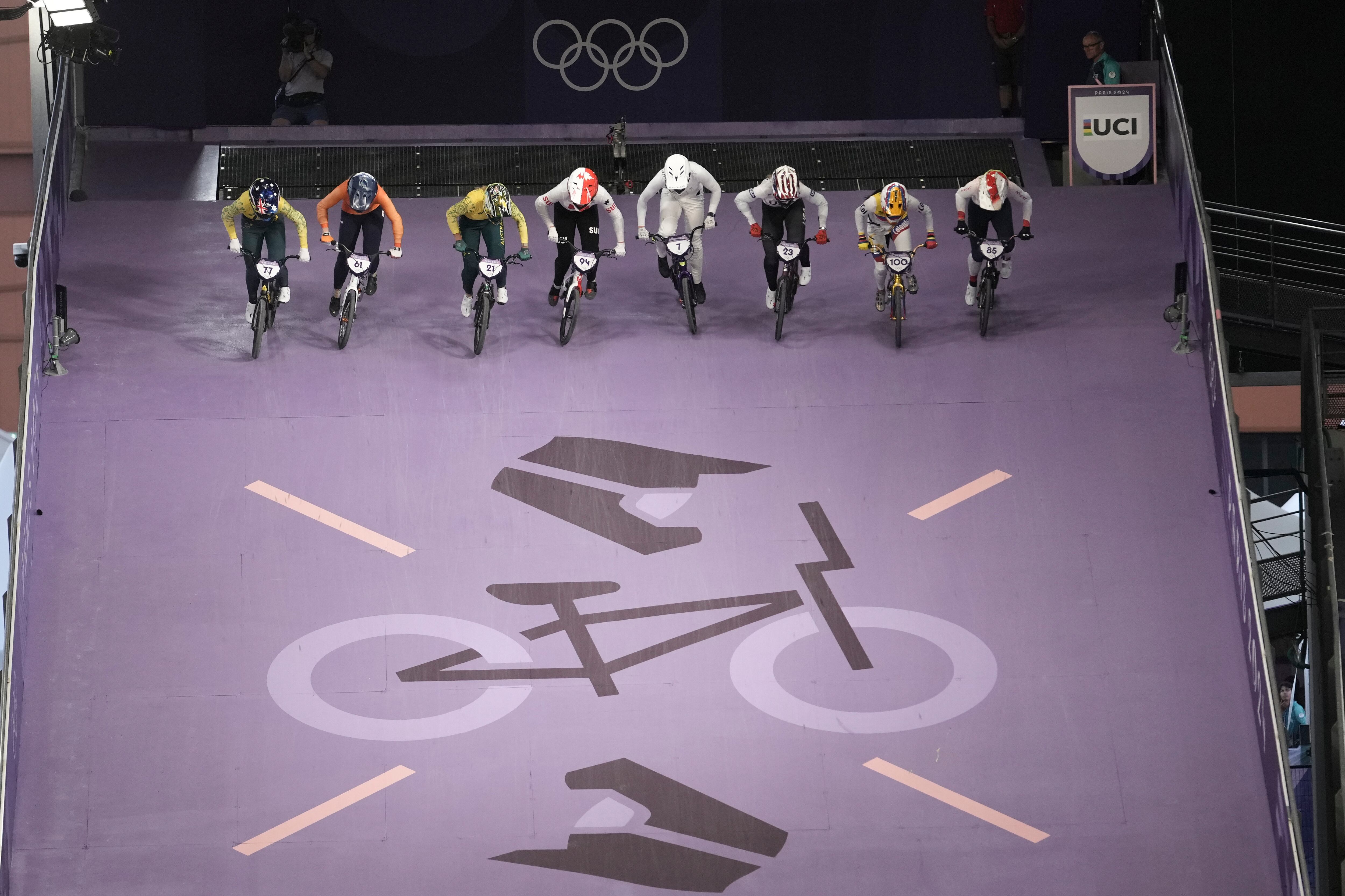 From left, Saya Sakakibara of Australia, Manon Veenstra of Netherlands, Lauren Reynolds of Australia, Nadine Aeberhard of Switzerland, Leila Walker of New Zealand, Felicia Stancil of The United States, Mariana Pajon Londono of Colombia and Sae Hatakeyama of Japan compete in the women's BMX racing event, at the 2024 Summer Olympics, Thursday, Aug. 1, 2024, in Saint-Quentin-en-Yvelines, France. (AP Photo/Thibault Camus)
