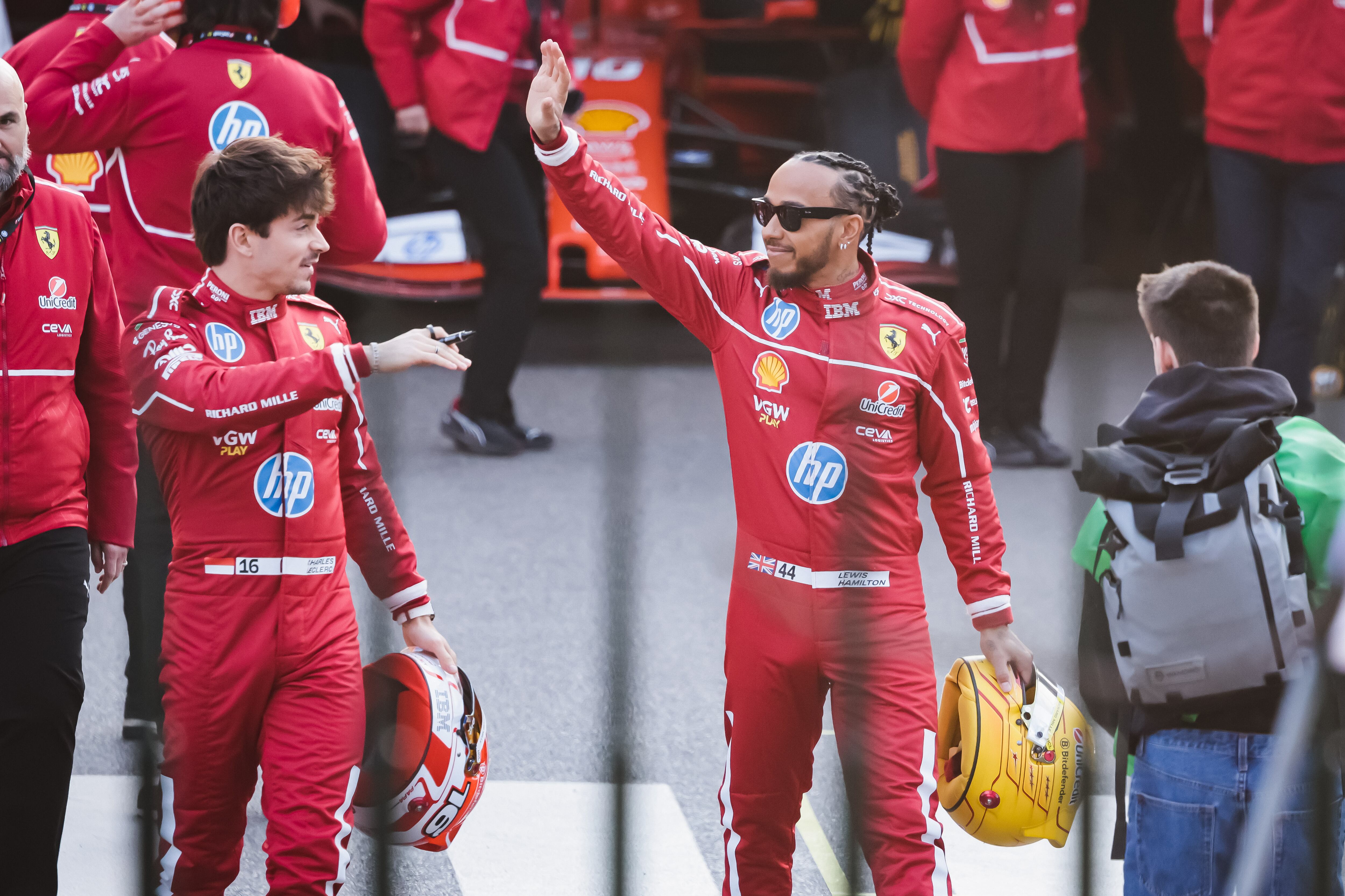 Lewis Hamilton and Charles Leclerc attend the Scuderia Ferrari HP Drivers' Presentation by UniCredit event with a street demo in the city circuit through the streets of the city center in Milan, Italy, on March 6, 2025 (Photo by Alessandro Bremec/NurPhoto via Getty Images).