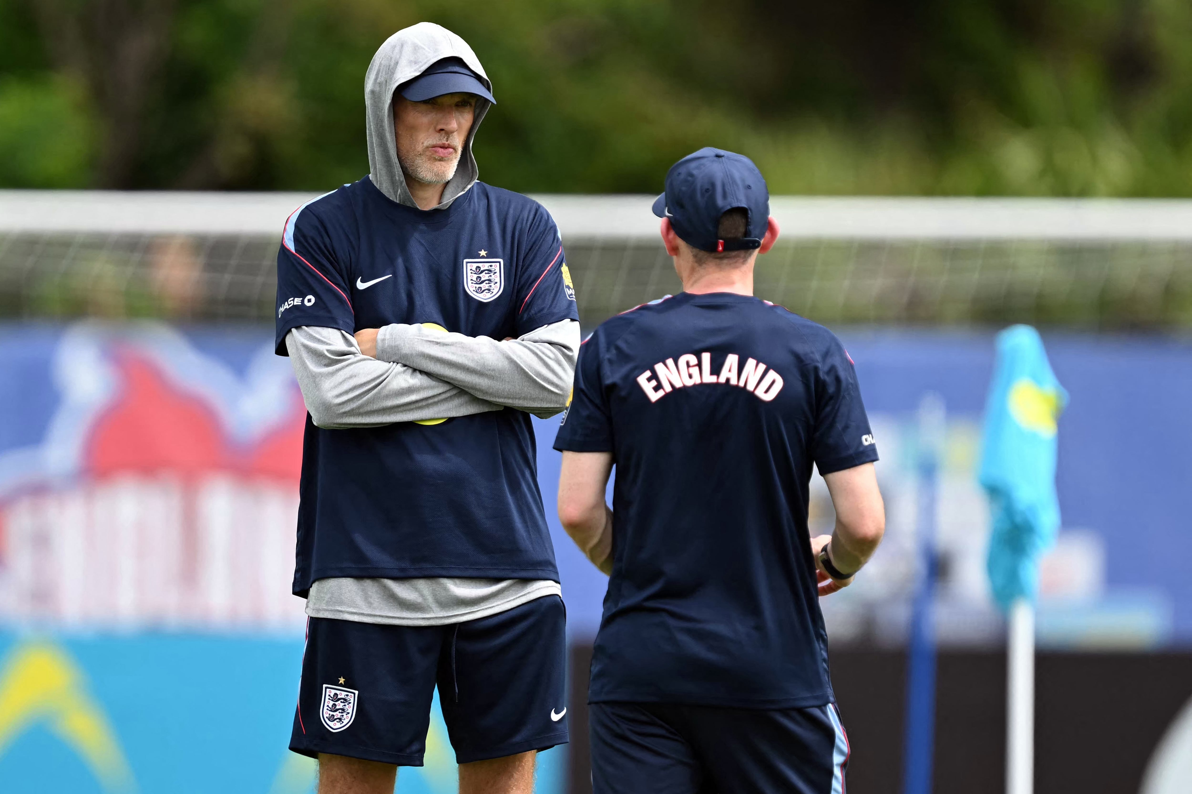 England's German head coach Thomas Tuchel speaks with his assistant during a training session as part of the team's preparation for its FIFA World Cup football tournament opening match against Croatia at the team's training camp in Palm Beach Gardens on June 9, 2026. (Photo by CHANDAN KHANNA / AFP)