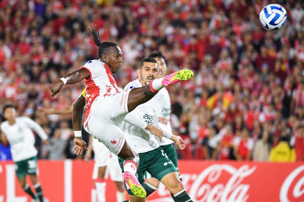 BOGOTA, COLOMBIA - JUNE 28: Hugo Rodallega of Santa Fe shoots on target as Hugo of Goias keeps an eye on the ball during the Copa CONMEBOL Sudamericana 2023 group G match between Independiente Santa Fe and Goias at El Campin stadium on June 28, 2023 in Bogota, Colombia. (Photo by Daniel Munoz/VIEWpress/Getty Images)