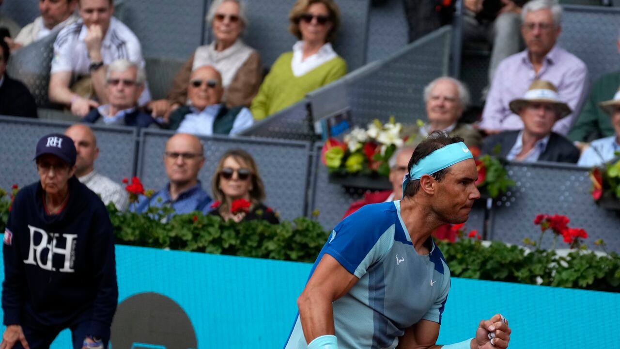 Rafael Nadal of Spain celebrates a winning point against Miomir Kecmanovic of Serbia during their match at the Mutua Madrid Open tennis tournament in Madrid, Spain, Wednesday, May 4, 2022. (AP Photo/Paul White)