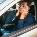 Desperate young driver, can't stand the traffic jam