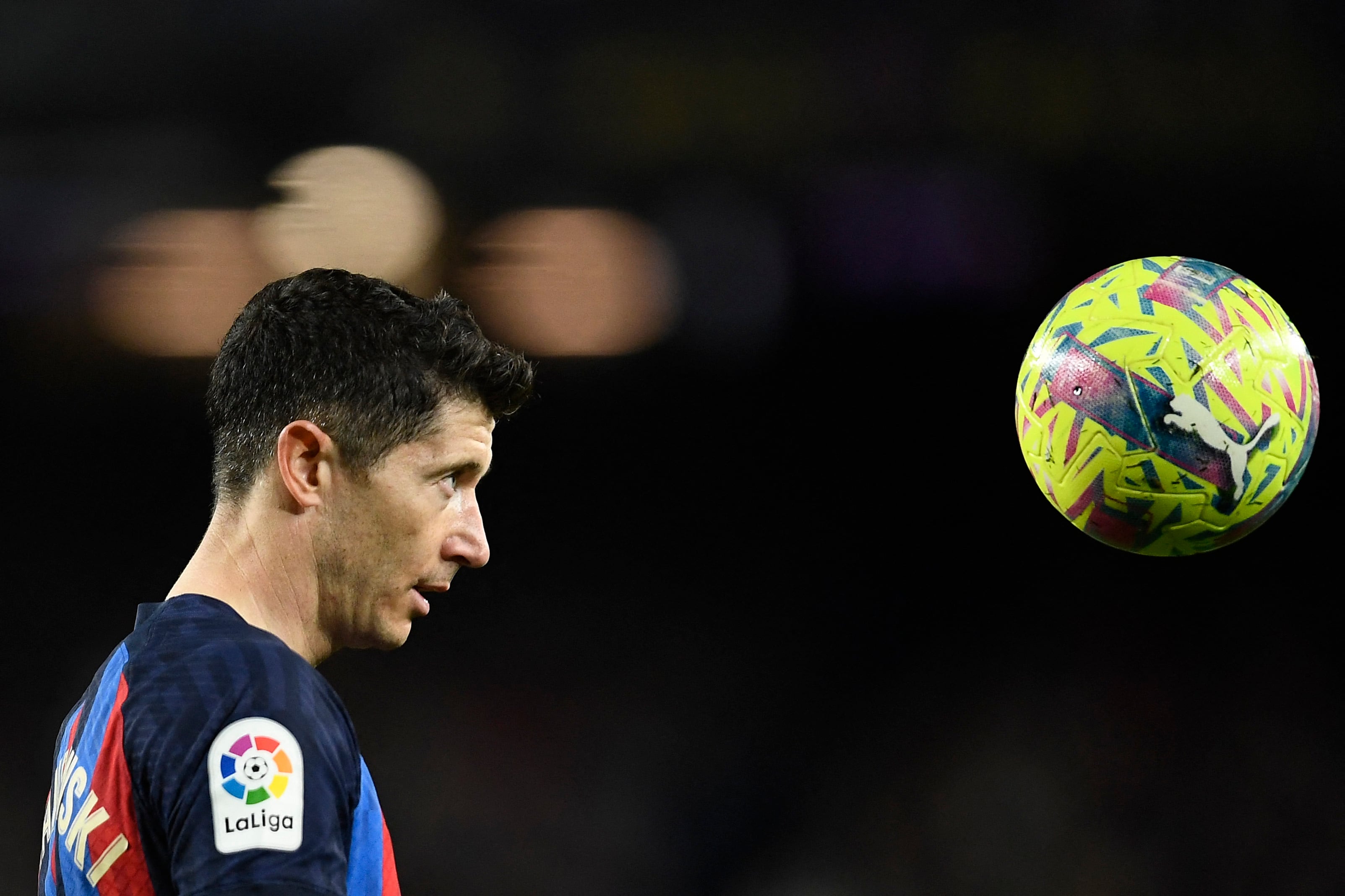 Barcelona's Polish forward Robert Lewandowski stares at the ball during the Spanish league football match between FC Barcelona and Girona FC at the Camp Nou stadium in Barcelona on April 10, 2023. (Photo by Pau BARRENA / AFP)