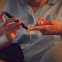 Diabetic, Diabetes or chronic disease by a woman testing blood sugar or glucose levels at home using a lancet pen. Closeup of a female piercing her finger to control her health condition