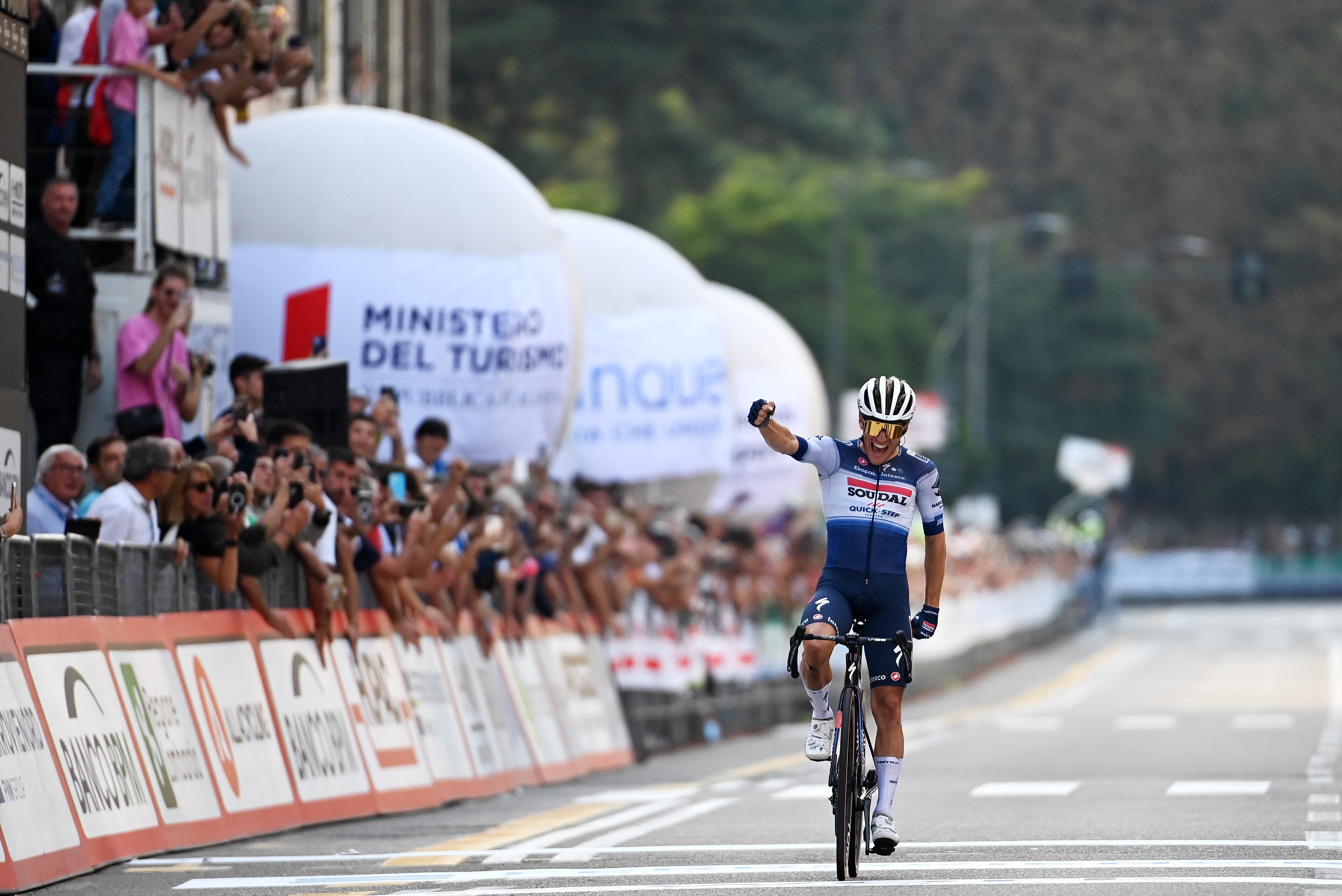VARESE, ITALY - OCTOBER 03: Ilan Van Wilder of Belgium and Team Soudal - Quick Step celebrates at finish line as race winner during the 102nd Tre Valli Varesine 2023 a 196.54km one day race from Busto Arsizio to Varese on October 03, 2023 in Varese, Italy. (Photo by Tim de Waele/Getty Images)