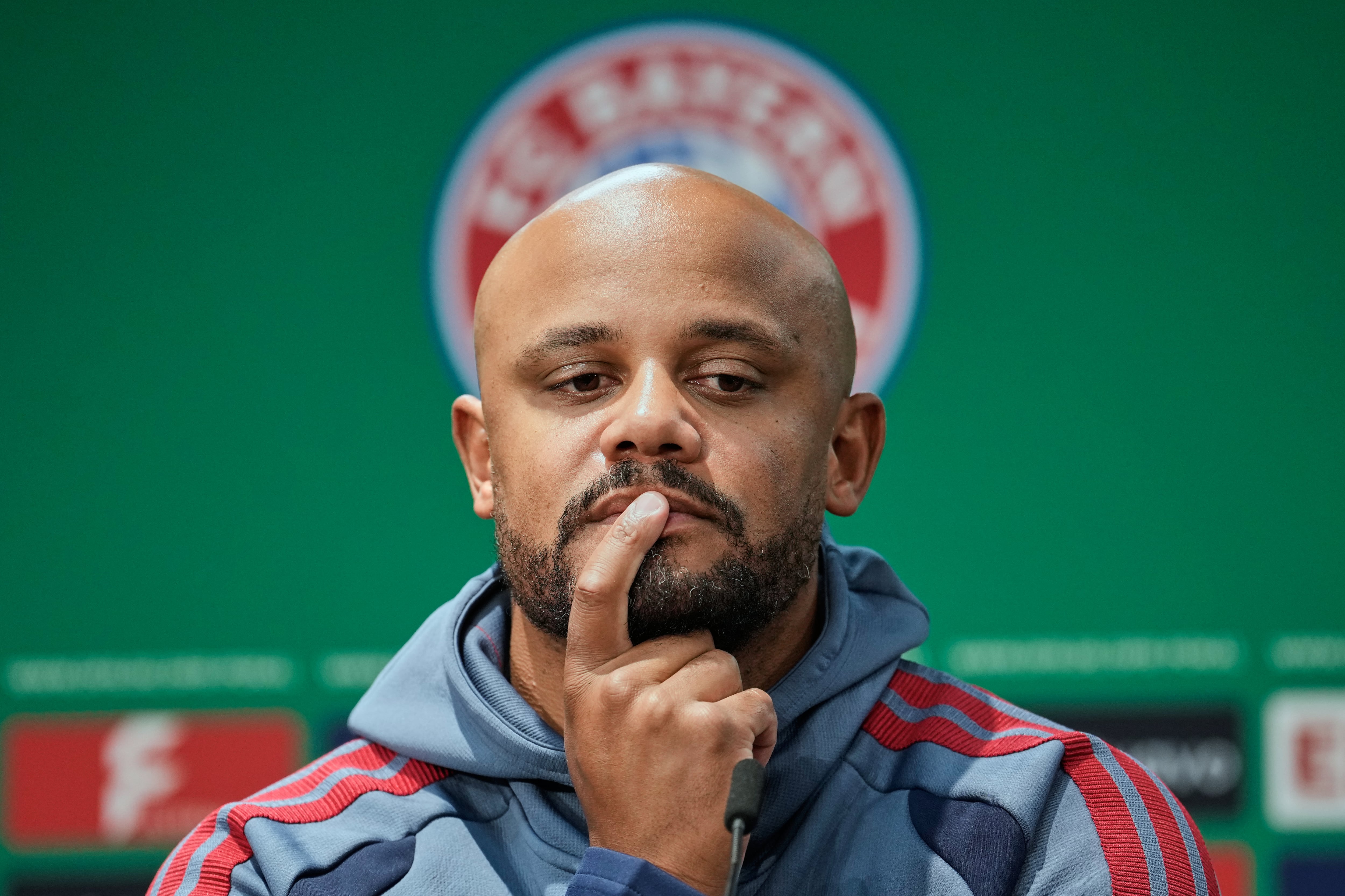Bayern Munich coach Vincent Kompany attends a joint press conference with VfB Stuttgart coach Sebastian Hoeness prior to the DFB Cup final between VfB Stuttgart and Bayern Munich at the Olympic stadium in Berlin, Germany, Friday, May 22, 2026. (AP Photo/Ebrahim Noroozi)