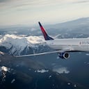 Boeing 737-900ER in-flight near Mount Rainier, Seattle, WA. - These images are protected by copyright. Delta has acquired permission from the copyright owner to the use the images for specified purposes and in some cases for a limited time. If you have been authorized by Delta to do so, you may use these images to promote Delta, but only as part of Delta-approved marketing and advertising. Further distribution (including proving these images to third parties), reproduction, display, or other use is strictly prohibited.