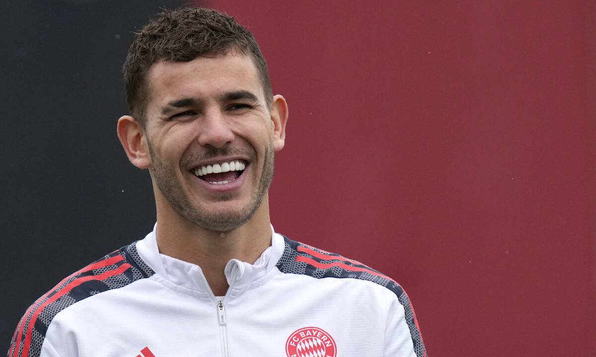 FC Bayern Munich's Lucas Hernandez laughs during a training session in Munich, Germany, Tuesday, Oct. 19, 2021. Bayern will face Portuguese team Benfica in Lisbon for a Champions League group E soccer match on Wednesday, Oct. 20, 2021. (AP/Matthias Schrader)