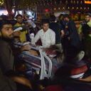 EDITORS NOTE: Graphic content / Volunteers and medical staff bring an injured man on a stretcher for treatment after two powerful explosions, which killed at least six people, outside the airport in Kabul on August 26, 2021. (Photo by Wakil KOHSAR / AFP)