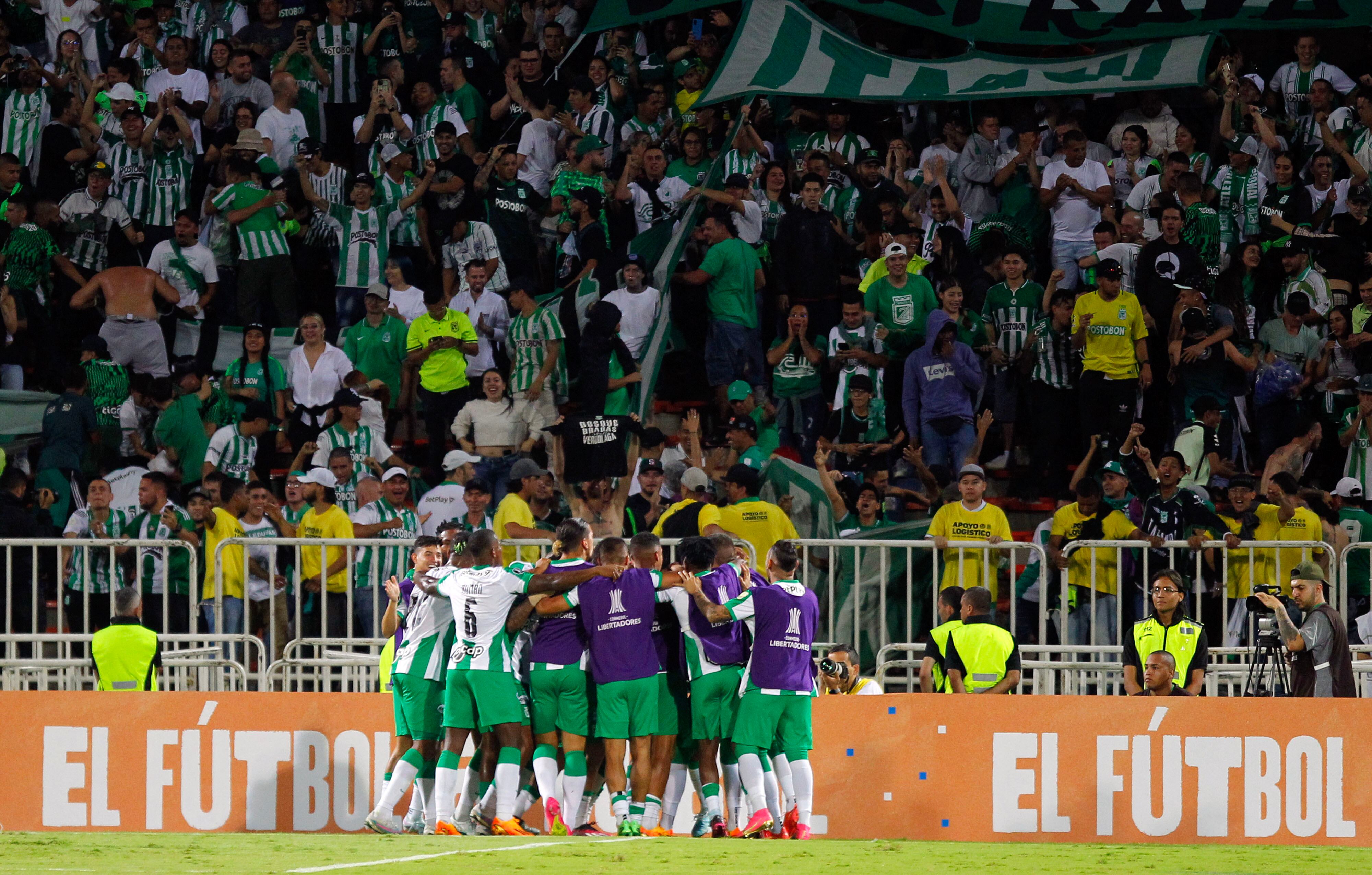 Atletico Nacional's players celebrate a goal during the Copa Libertadores group stage first leg football match between Atletico Nacional and Olimpia, at the Atanasio Girardot stadium in Medellin, Colombia, on May 2, 2023. (Photo by Fredy BUILES / AFP)