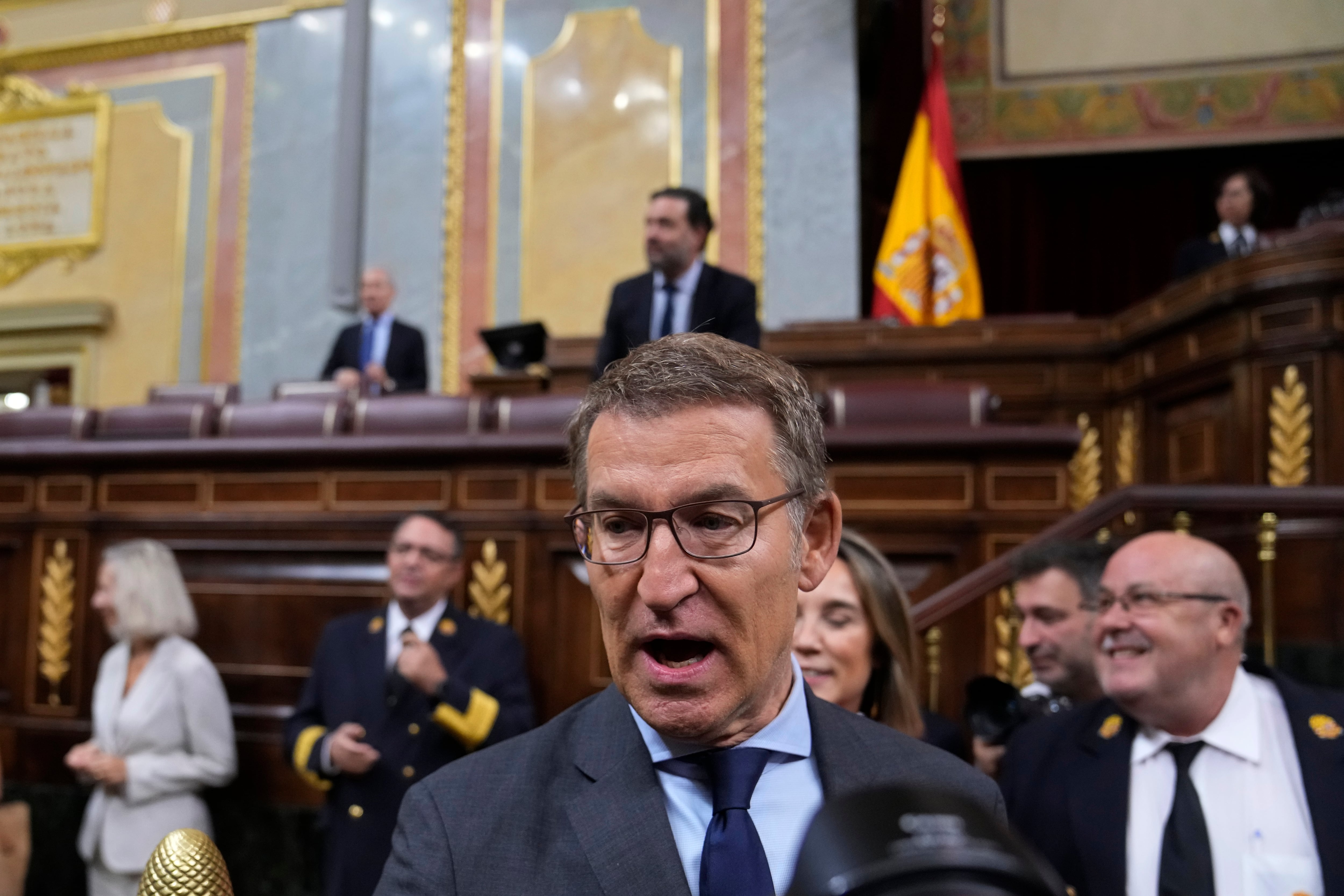 Alberto Nunez Feijoo arrives to take his seat during an investiture session at the Spanish parliament in Madrid, Spain, Wednesday, Sept. 27, 2023. The leader of Spain's conservatives Alberto Feijoo faces the first of two investiture votes, Wednesday that will determine whether he can become prime minister. Spain's July 23 national election gave Feijoo's Popular Party the most seats in the parliament's 350-member lower chamber but well shy of an absolute majority. (AP Photo/Paul White)