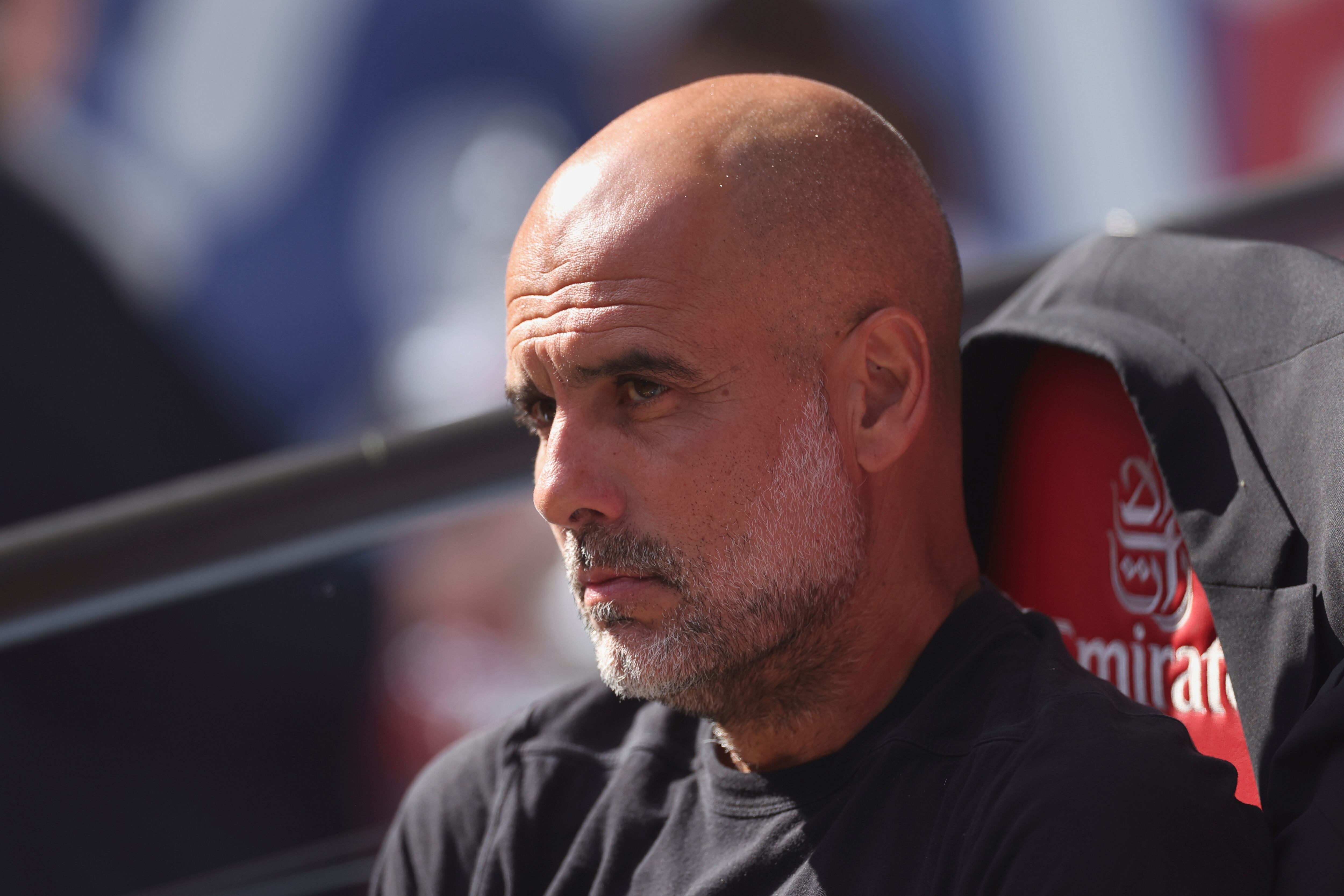 Manchester City's head coach Pep Guardiola sits before the FA Cup final between Manchester City and Crystal Palace at the Wembley Stadium in London, Saturday, May 17, 2025. (AP Photo/Ian Walton)