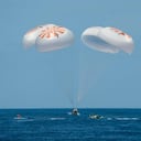 This handout photo courtesy of SpaceX released on April 25, 2022 on the Twitter account of Axiom Space, shows the crew Dragon capsule Endeavour splashes down in the Atlantic Ocean with the Axiom Space Ax-1 crew on April 25, 2022. - Three businessmen and a former NASA astronaut splashed down Monday off the Florida coast after spending two weeks aboard the International Space Station in a landmark mission for the commercial sector. (Photo by Handout / SPACEX / AFP) / RESTRICTED TO EDITORIAL USE - MANDATORY CREDIT "AFP PHOTO / SpaceX" - NO MARKETING - NO ADVERTISING CAMPAIGNS - DISTRIBUTED AS A SERVICE TO CLIENTS