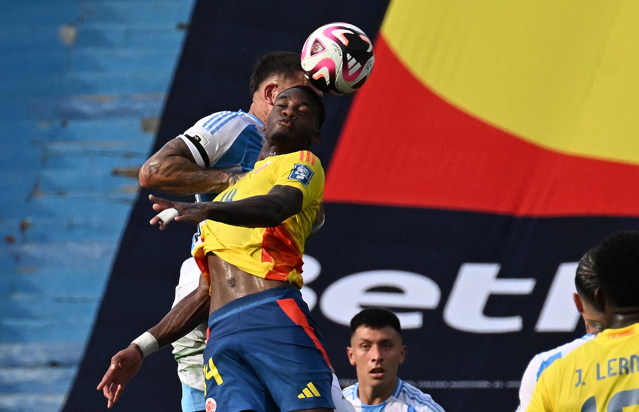 Colombia's forward Jhon Dur�n (Front) heads the ball during the 2026 FIFA World Cup South American qualifiers football match between Colombia and Argentina, at the Metropolitano Roberto Mel�ndez stadium in Barranquilla, Colombia, on September 10, 2024. (Photo by JOAQUIN SARMIENTO / AFP)