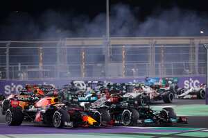 Red Bull driver Max Verstappen of the Netherlands, left, and Mercedes driver Lewis Hamilton of Britain in action during the Formula One corniche circuit, in Jiddah, Saudi Arabia, Sunday, Dec. 5, 2021. (AP Photo/Amr Nabil)