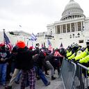 Trump supporters try to break through a police barrier, Wednesday, Jan. 6, 2021, at the Capitol in Washington. As Congress prepares to affirm President-elect Joe Biden's victory, thousands of people have gathered to show their support for President Donald Trump and his claims of election fraud. (AP Photo/Julio Cortez)