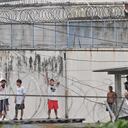 Inmates protest demanding the return to this prison of the leader of the "Los Choneros" gang, alias Fito, at the Zonal Penitentiary No. 8 in Guayaquil, Ecuador, on August 14, 2023. Alias Fito was transferred on Saturday, August 12 to La Roca, a maximum-security prison within the same penitentiary complex. (Photo by STRINGER / AFP)