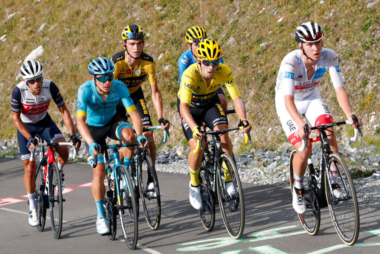 From left, Australia's Richie Porte, Colombia's Miguel Angel Lopez, Sepp Kuss of the US, Slovenia's Primoz Roglic wearing the overall leader's yellow jersey, and Slovenia's Tadej Pogacar, climb the Loze pass during the stage 17 of the Tour de France cycling race over 170 kilometers (105 miles), with start in Grenoble and finish in Meribel Col de la Loze, Wednesday, Sept. 16, 2020. (AP Photo/Christophe Ena)