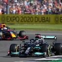 Mercedes driver Lewis Hamilton of Britain steers his car followed by Red Bull driver Max Verstappen of the Netherlands during the warm up lap before the Sprint Qualifying of the British Formula One Grand Prix, at the Silverstone circuit, in Silverstone, England, Saturday, July 17, 2021. The British Formula One Grand Prix will be held on Sunday. (AP Photo/Jon Super)