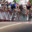 Stage winner Team Deceuninck's French rider Florian Senechal (L) sprints with second placed Team UAE Emirates' Italian rider Matteo Trentin at the finish of the 13th stage of the 2021 La Vuelta cycling tour of Spain, a 203.7 km race from Belmez to Villanueva de la Serena, on August 27, 2021. (Photo by JORGE GUERRERO / AFP)