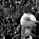 In this image taken from video released by NASA, the Osiris-Rex spacecraft touches the surface of asteroid Bennu on Tuesday, Oct. 20, 2020. (NASA via AP)