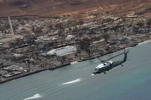 U.S. President Joe Biden, aboard Marine One, inspects the fire-ravaged town of Lahaina on the island of Maui in Hawaii, U.S., August 21, 2023. REUTERS/Kevin Lamarque REFILE - CORRECTING INFORMATION FROM THE BIDENS ARRIVING TO AERIAL INSPECTION