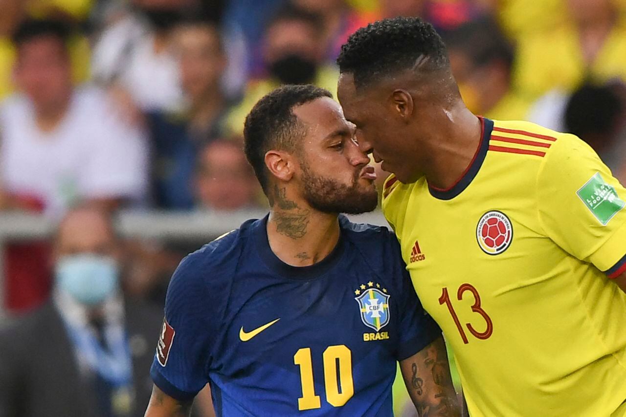 Brazil's Neymar (L) and Colombia's Yerry Mina (R) are seen during their South American qualification football match for the FIFA World Cup Qatar 2022 at the Metropolitano stadium in Barranquilla, Colombia, on October 10, 2021.
JUAN BARRETO / AFP