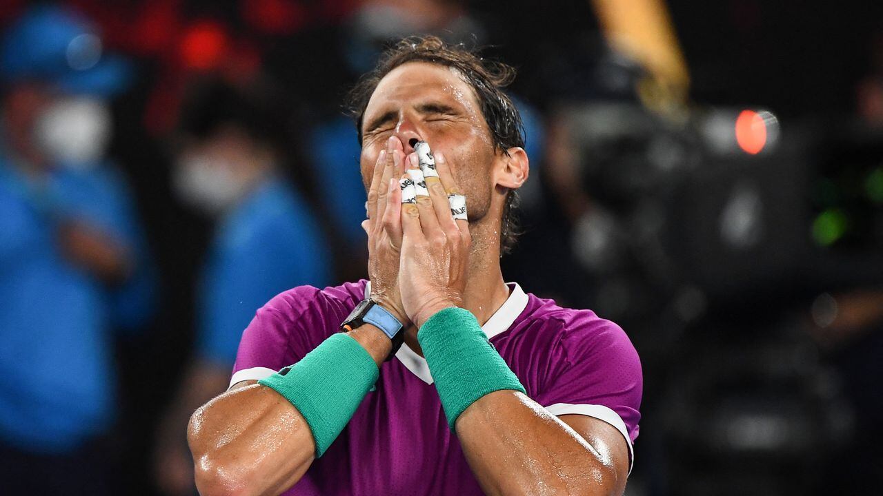 Spain's Rafael Nadal celebrates after victory against Italy's Matteo Berrettini during their men's singles semi-final match on day twelve of the Australian Open tennis tournament in Melbourne on January 28, 2022. (Photo by William WEST / AFP) / -- IMAGE RESTRICTED TO EDITORIAL USE - STRICTLY NO COMMERCIAL USE --