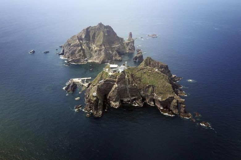A set of remote islands called Dokdo in Korean and Takeshima in Japanese is seen in this picture taken from a helicopter carrying South Korean President Lee Myung-bak (not pictured), east of Seoul August 10, 2012. REUTERS/The Blue House/Handout