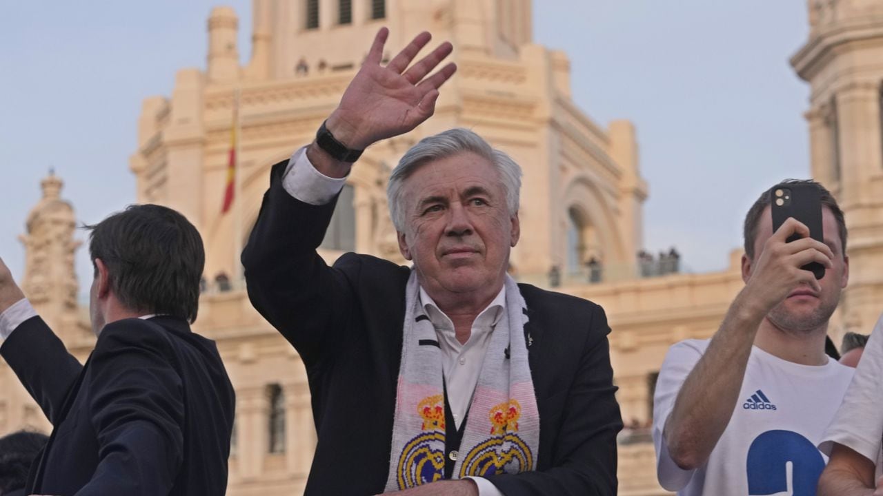 Real Madrid's head coach Carlo Ancelotti waves during celebrations after Real Madrid won the Spanish La Liga title by defeating Espanyol in Madrid, Spain, Saturday, April 30, 2022. (AP/Paul White)