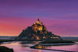 A pink sunset at Mont Saint-Michel, Normandy, France.