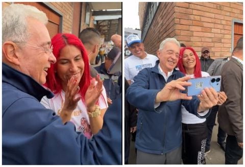 Álvaro Uribe junto a una seguidora que le pidió una fotografía.
