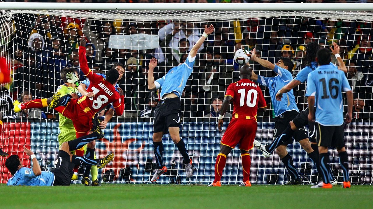 JOHANNESBURG, SOUTH AFRICA - JULY 02:  Luis Suarez of Uruguay handles the ball on the goal line, for which he is sent off, during the 2010 FIFA World Cup South Africa Quarter Final match between Uruguay and Ghana at the Soccer City stadium on July 2, 2010 in Johannesburg, South Africa.  (Photo by Michael Steele/Getty Images)