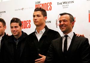 MADRID, SPAIN - JANUARY 22: Cristiano Ronaldo (C) and James Rodriguez (L) attend the presentation of the book 'The Key to Mendes' ('La Clave Mendes') by sport agent Jorge Mendes (R) at Palace Hotel on January 22, 2015 in Madrid, Spain.  (Photo by Europa Press/Europa Press via Getty Images)