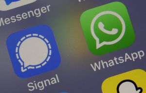 PARIS, FRANCE - JANUARY 11: In this photo illustration, the logos of social media applications, Signal and WhatsApp are displayed on the screen of an iPhone on January 11, 2021 in Paris, France. In recent days, many WhatsApp users have migrated to Signal following the modification of WhatsApp's terms of use concerning personal data. WhatsApp has come under fire since Thursday after asking its nearly two billion users to agree to new terms of service, allowing it to share more data with its parent company Facebook. As a result, the Signal messaging application is experiencing a very strong increase in its subscriptions to the point of undergoing saturation phases. (Photo illustration by Chesnot/Getty Images)