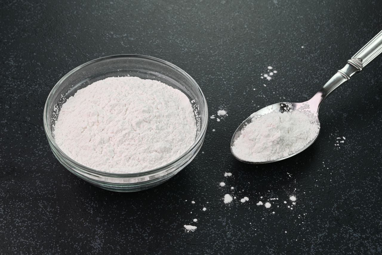 Closeup view of baking powder in a bowl.