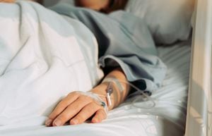 Asian woman lying sick in hospital.